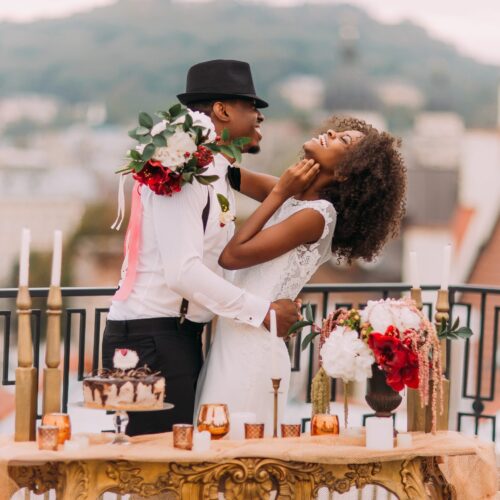 couple recently married embrace, image promote the wedding producer that uses storybrand framework on their wordpress website